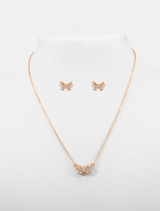 JUEGO DE ACCESORIOS EN ACERO INXODABLE COLOR DORADO DE COAR CON DIJE DE MARIPOSA CON PIEDRA DE CRISTAL Y ARETES DE MOÑO - MICHELLE ACCESORIOS