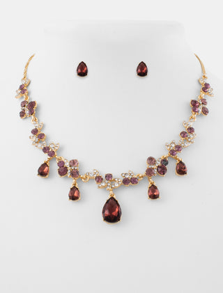 JUEGO DE COLLAR Y ARETES TIPO BROQUEL DE METAL DORADO CON PEDRERÍA ROSA Y BLANCA EN FORMA DE GOTAS - MICHELLE ACCESORIOS