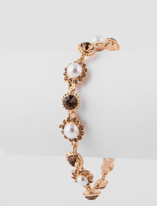 PULSERA CON FLORES DE METAL DORADO CON PEDRERÍA DE COLOR CHAMPAGNE - MICHELLE ACCESORIOS