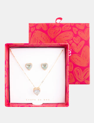 SET EN CHAPA DE ORO DE LA COLECCIÓN SAN VALENTÍN COLOR DORADO CON ARETES EN FORMA DE CORAZÓN CON PIEDRA COLOR AZUL CIELO Y COLLAR CON DIJE DE CORAZÓN AZUL CON PIEDRA DE ZIRCONIA - MICHELLE ACCESORIOS
